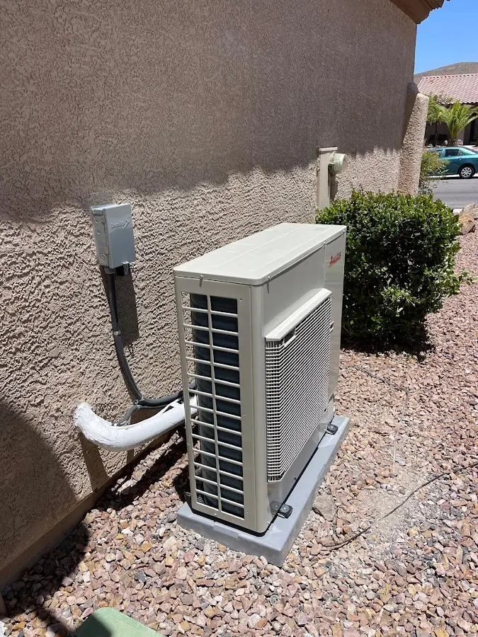 Residential air conditioning condenser unit in Parsons